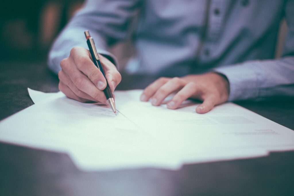 A man writing documentation